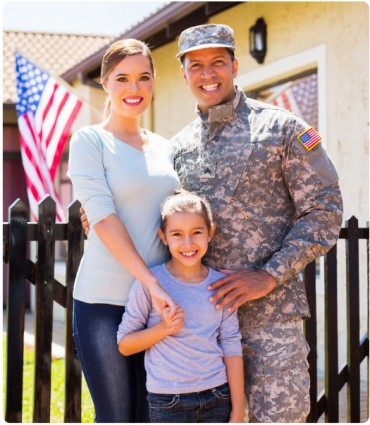 Military family outside house